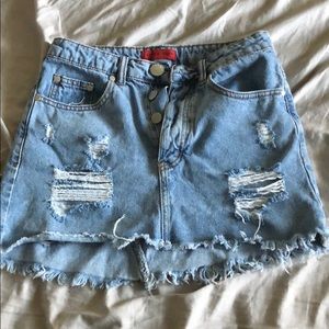 Super cute distressed Jean skirt with holes